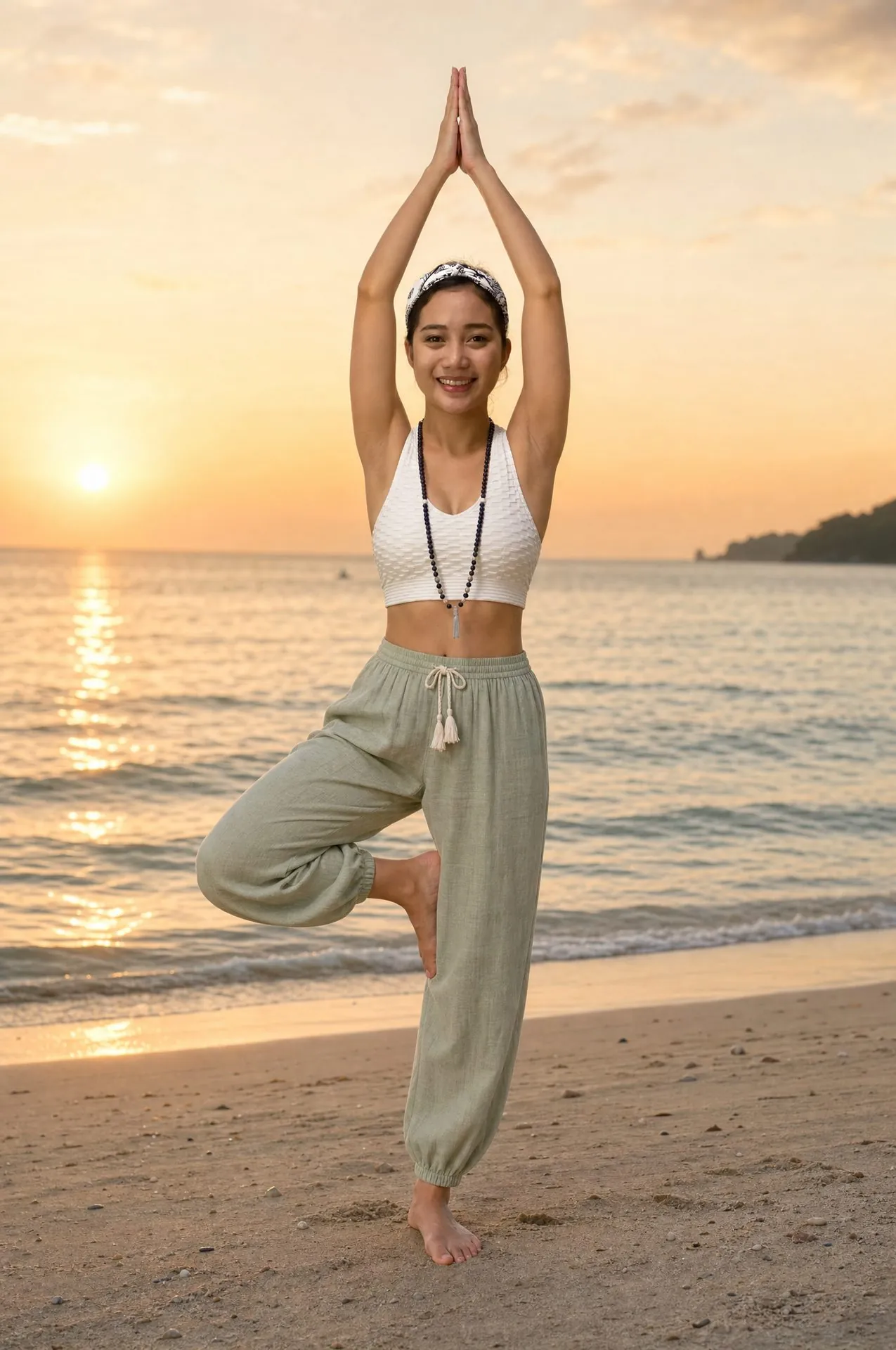 Alona practicing tree pose by the beach